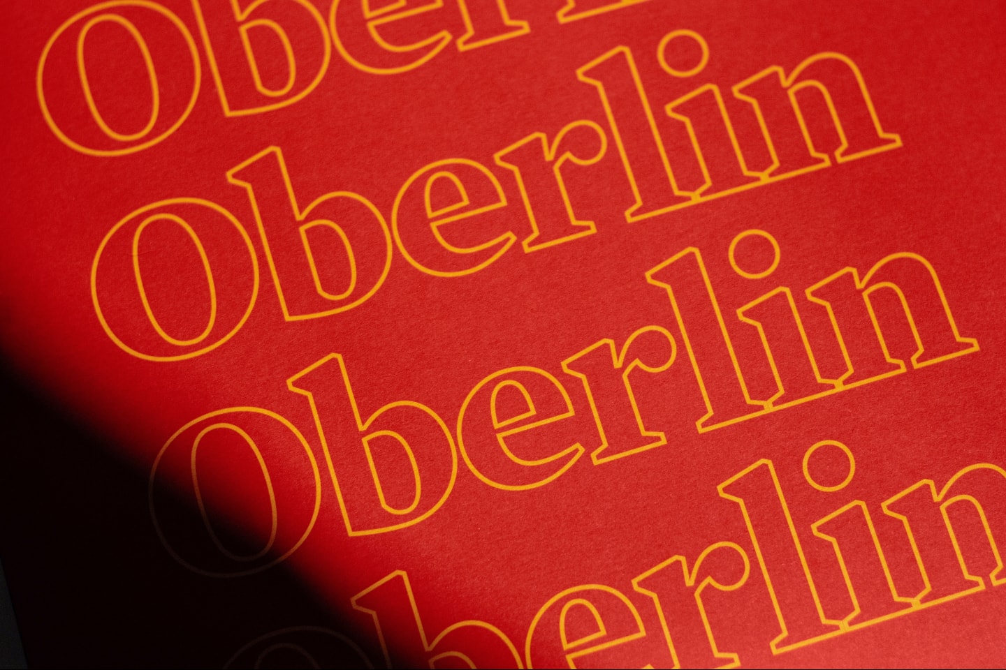 Red Oberlin admission envelopes stacked and ready to mail
